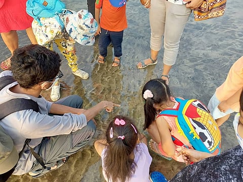 Fascinated kids on an MLOM shore walk
